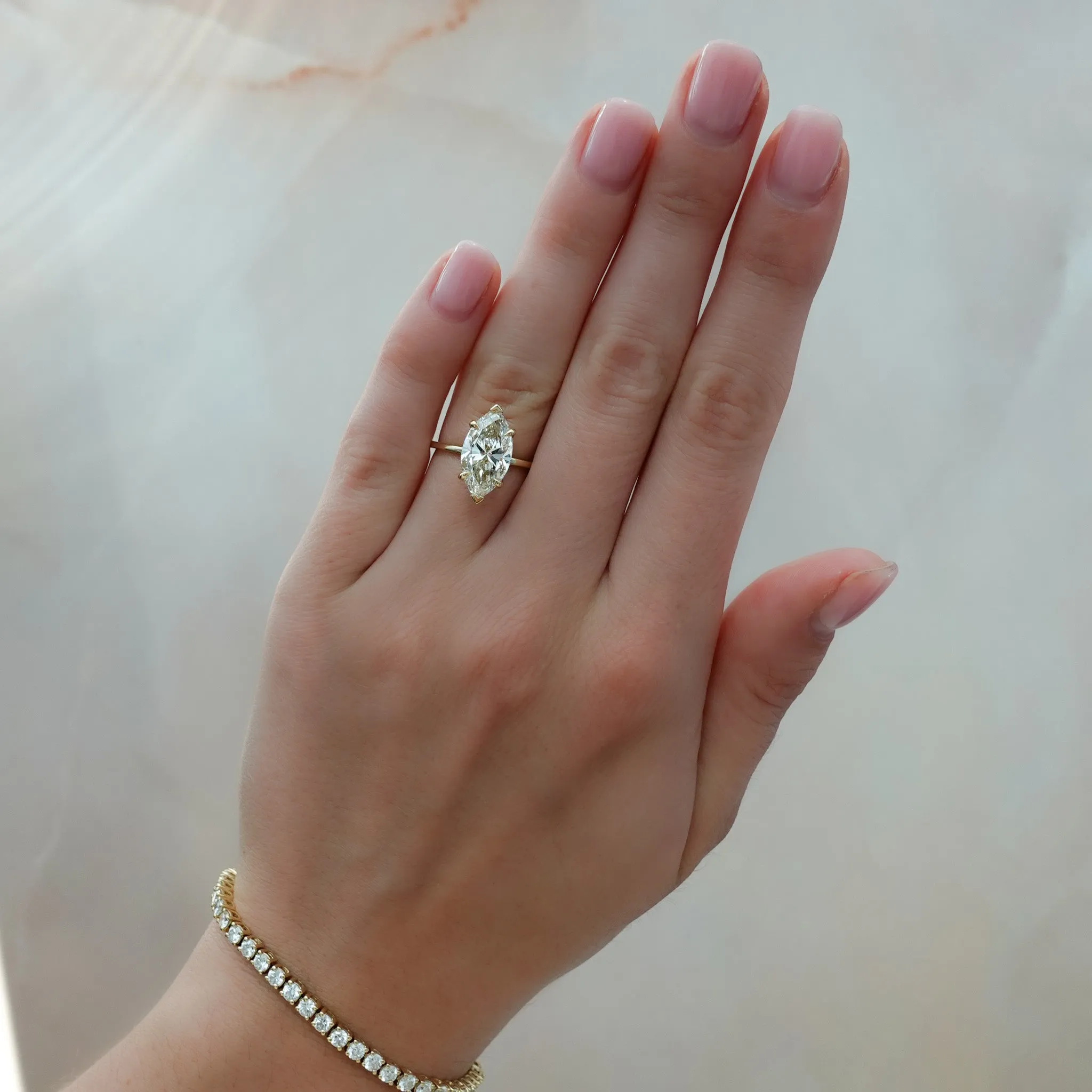 Thin   Simple Solitaire Engagement Ring With Marquise Cut Diamond