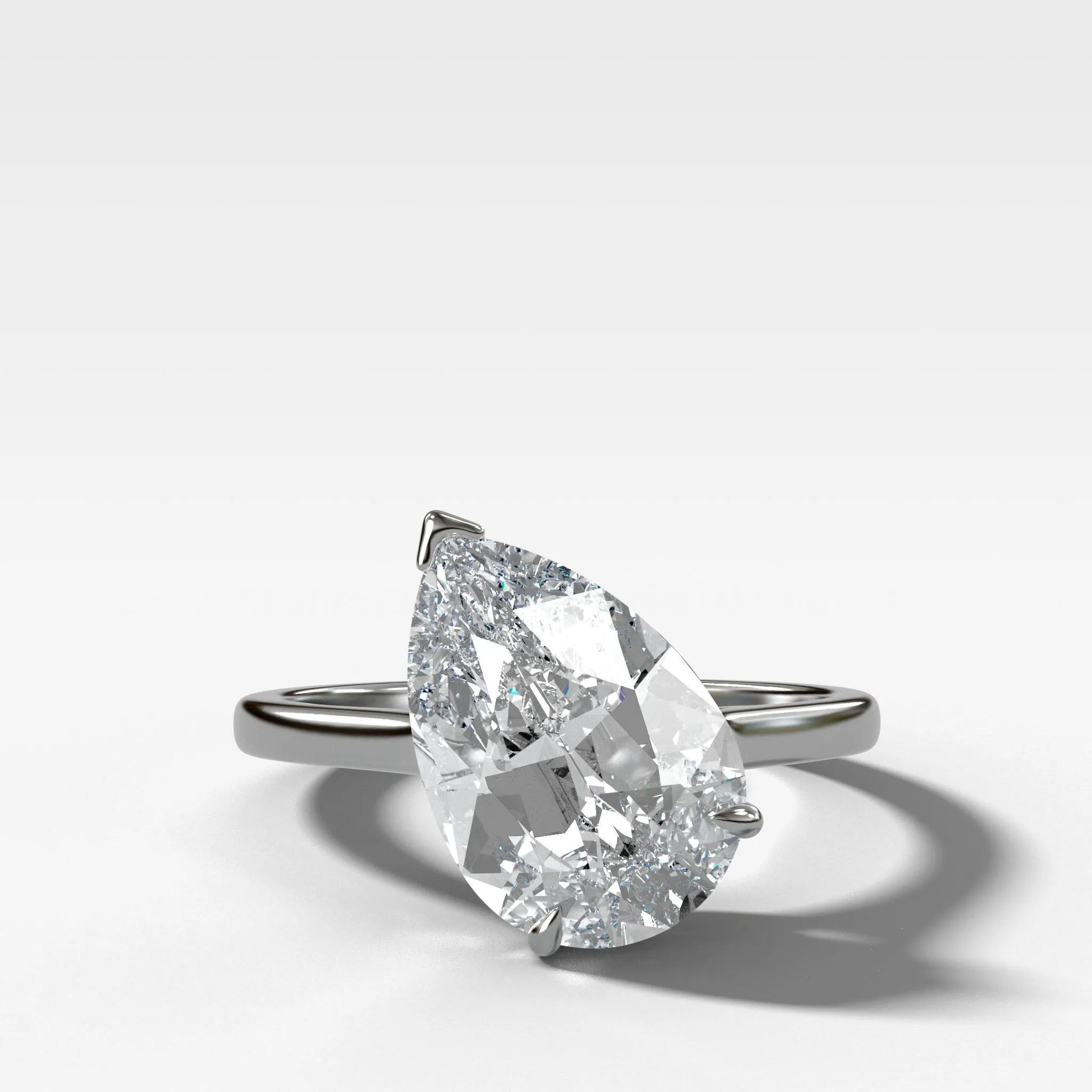 Tilted Thin   Simple Solitaire Engagement Ring With Pear Cut Diamond