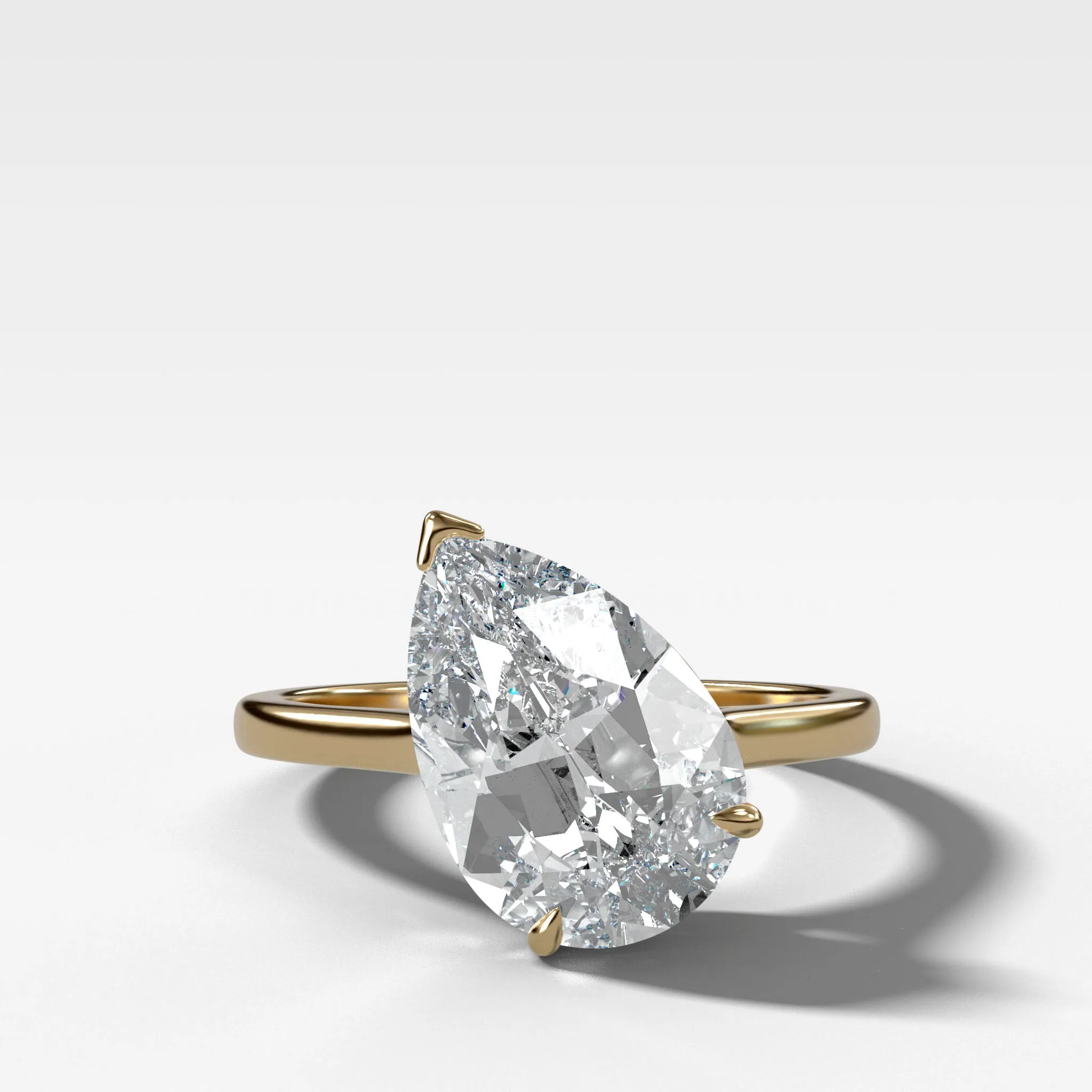 Tilted Thin   Simple Solitaire Engagement Ring With Pear Cut Diamond